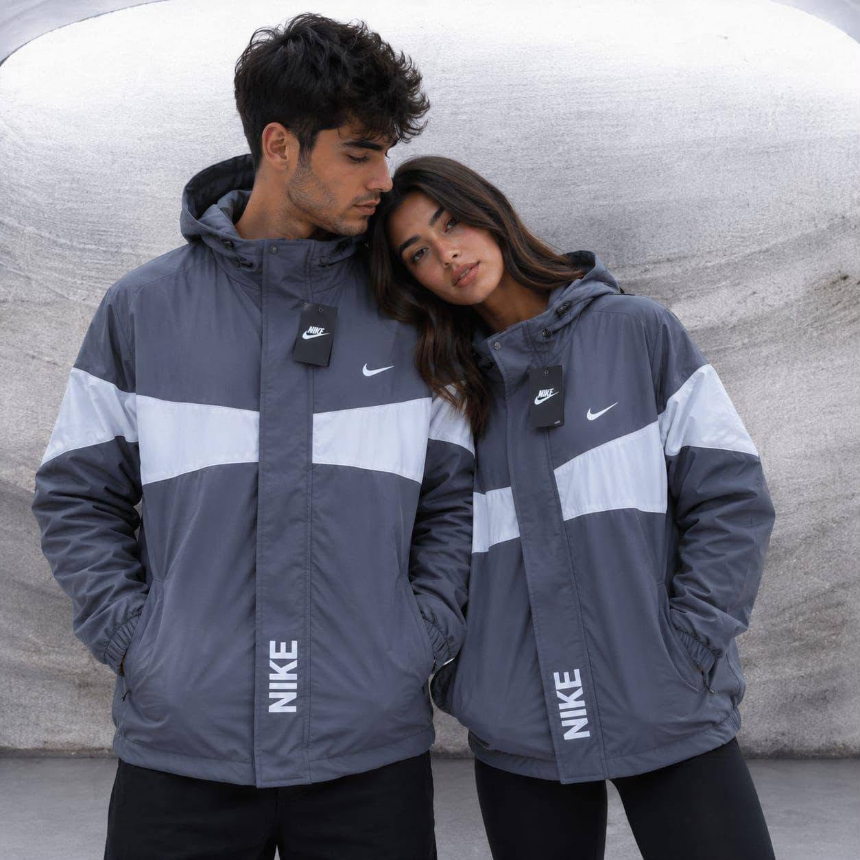 Couple wearing matching grey jackets