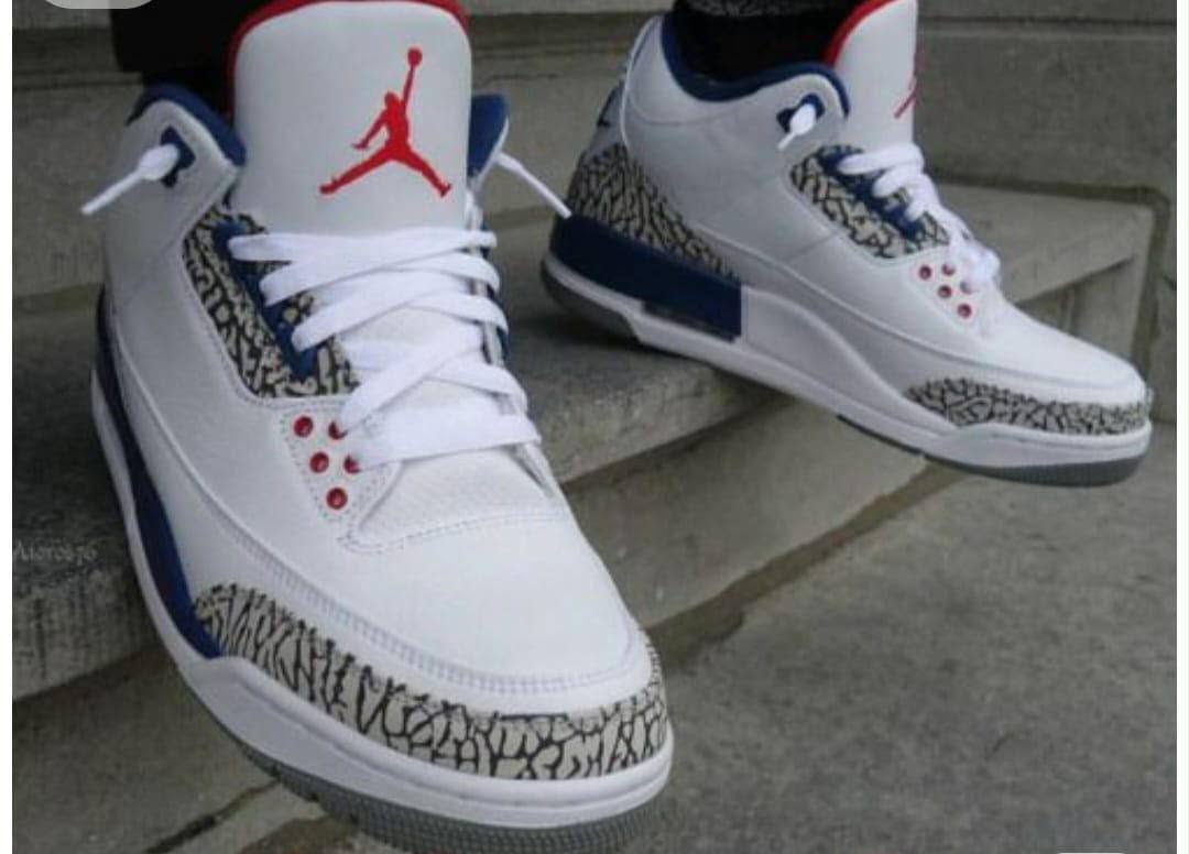 White sneakers with red and blue detail